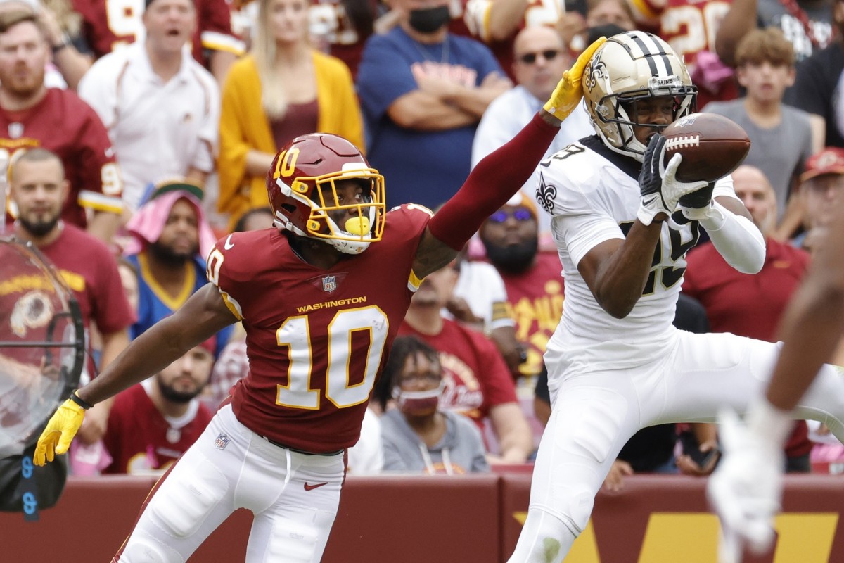 New Orleans Saints cornerback Paulson Adebo (29) intercepts a pass intended for Washington receiver Curtis Samuel (10). Mandatory Credit: Geoff Burke-USA TODAY Sports